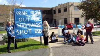 Campaigners block the entrance to General Dynamics' site in Hastings